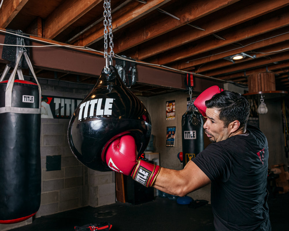 TITLE Boxing Aqua Training Punch Bag guy throwing hook